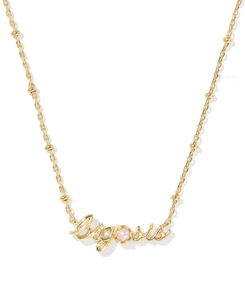 The Big Sis Necklace from Kendra Scott features a delicate gold chain with "big sis" in cursive and a small pearl on the “i.” Available in standard necklace lengths.