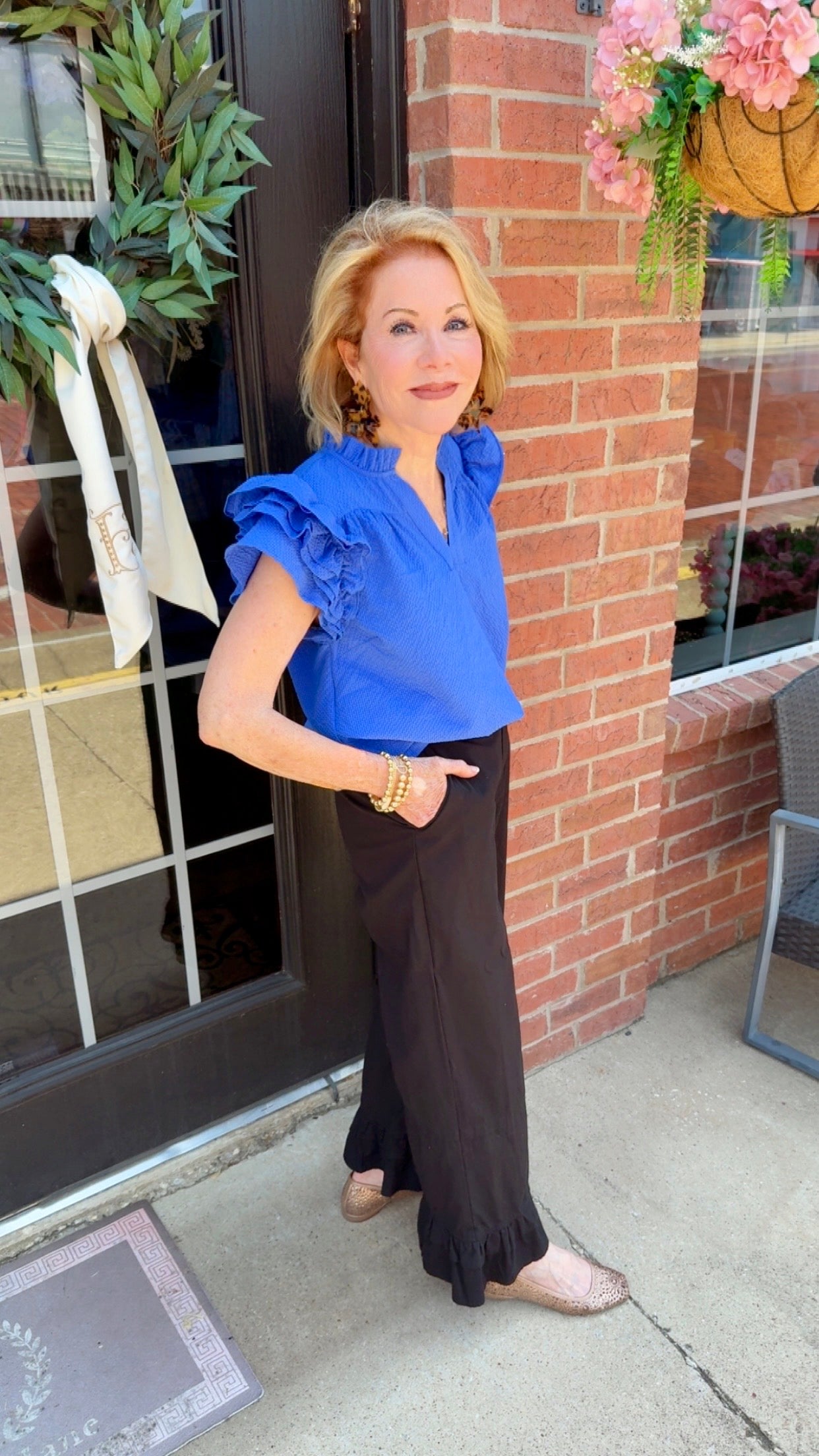 Ocean Breeze Ruffle Sleeve Top in ocean blue, featuring ruffled sleeves. Available in sizes XS-XL.