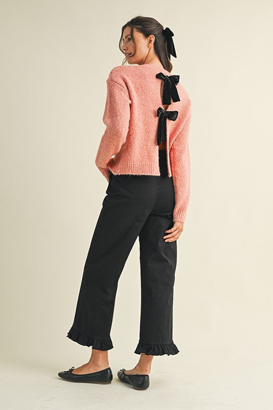 Black Ruffle Hem Cropped Pants with ruffle detail at hem. Available in sizes XS–XL.