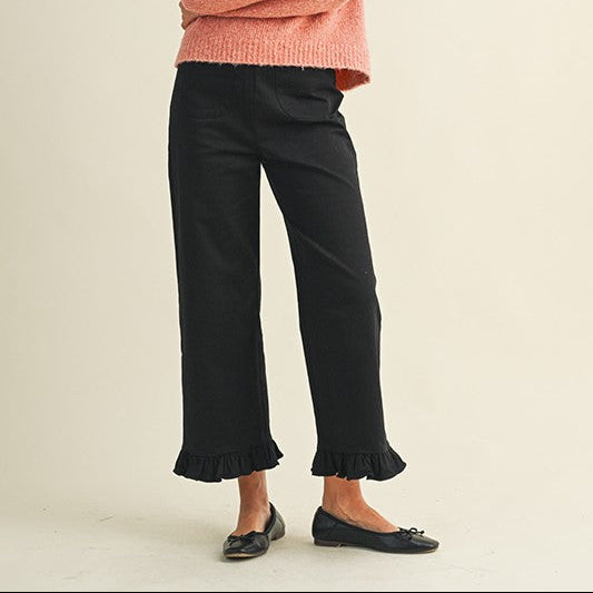 Black Ruffle Hem Cropped Pants shown; available in sizes XS–XL. Features ruffle hem and cropped fit.