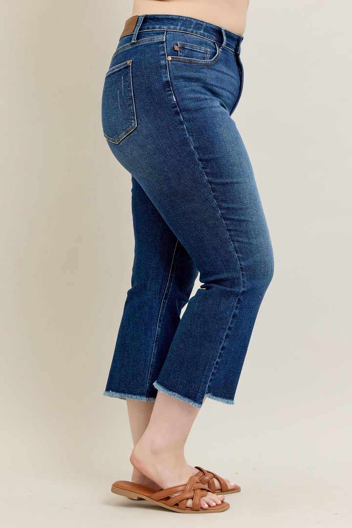 Judy Blue High Waist Dark Wash Kick Flare Jeans with frayed hems. Available in sizes 0-20.