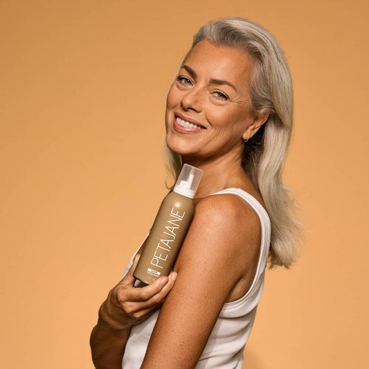 Gold bottle of Medium Self-Tanning Mousse shown; available in 6.7 fl oz and 3.38 fl oz sizes.