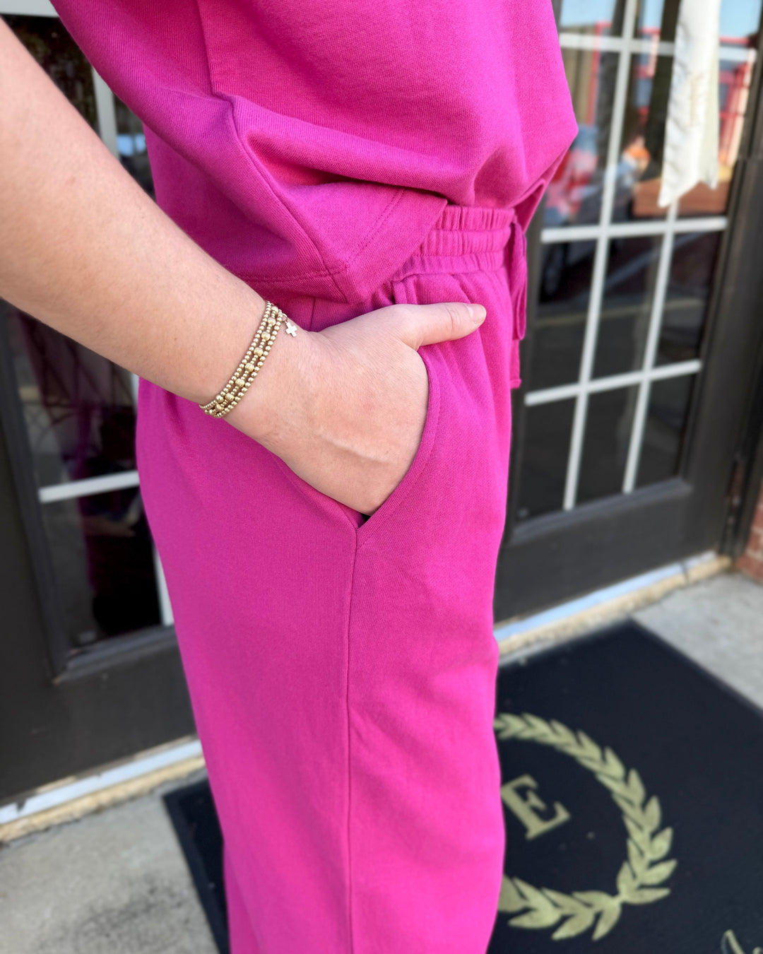 Fuchsia barrel-leg knit pants with drawstring waistband and side pockets. Available in all sizes.
