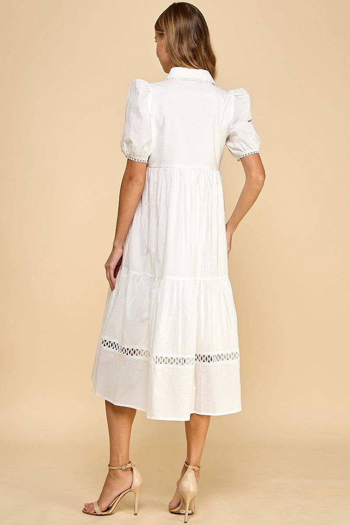 White button-up collared contrast trim midi dress with tiered skirt. Available in sizes XS–XL.