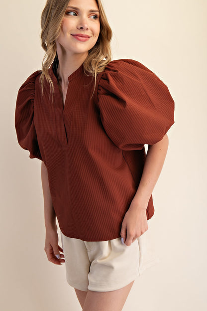 Rachel V-Neck Puff Sleeve Top in rust; available in XS-XL. Features puff sleeves and v-neckline.