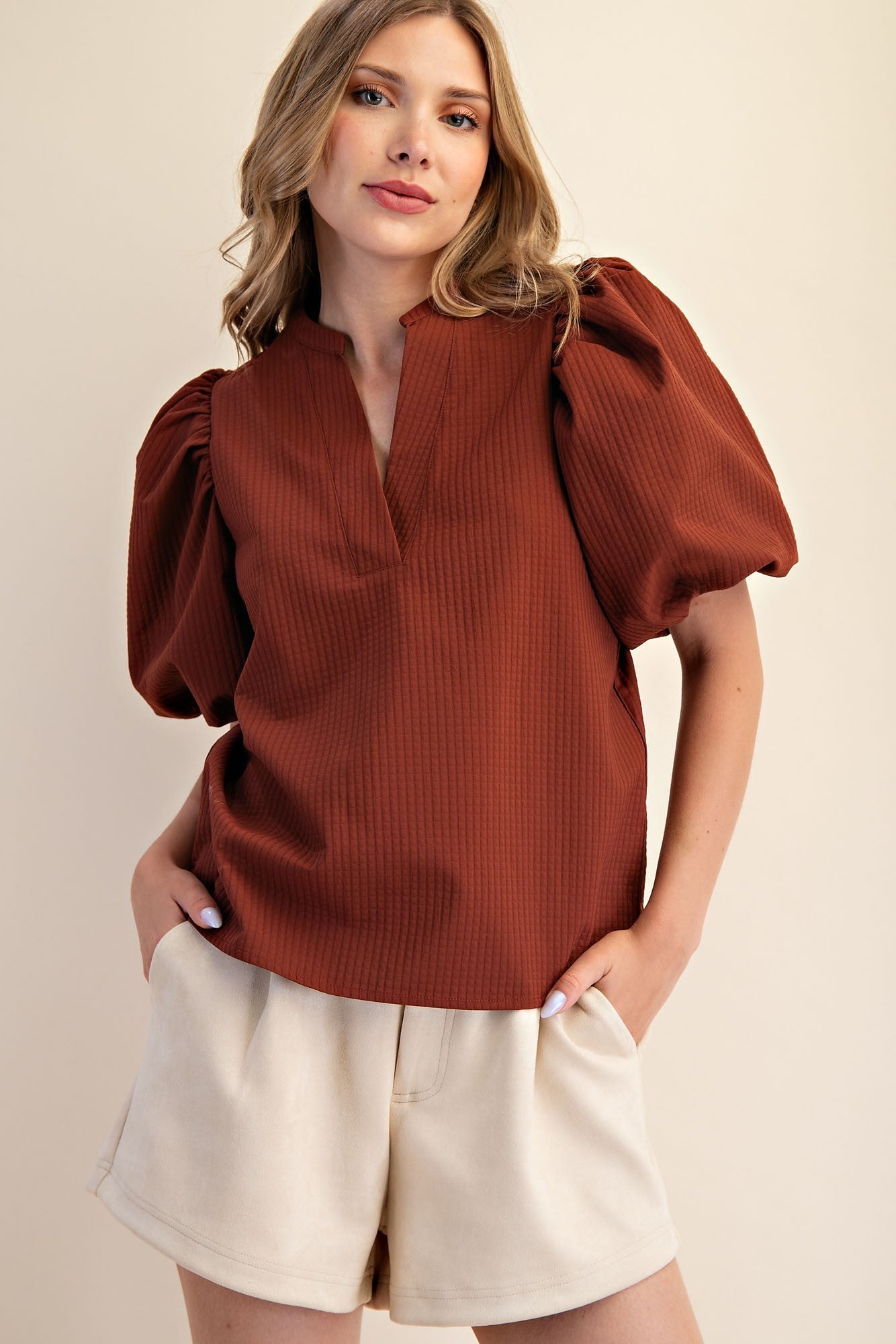 Rachel V-Neck Puff Sleeve Top in rust with waffle texture; available in sizes XS–XL.