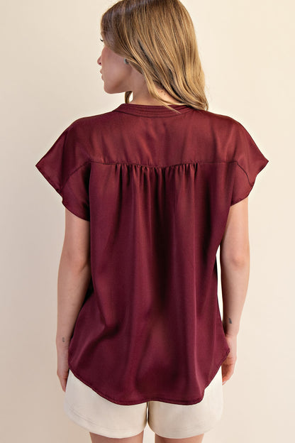 Jami Drop Cap Sleeve Satin Blouse in burgundy with gathered back detail. Sizes: XS-XL.