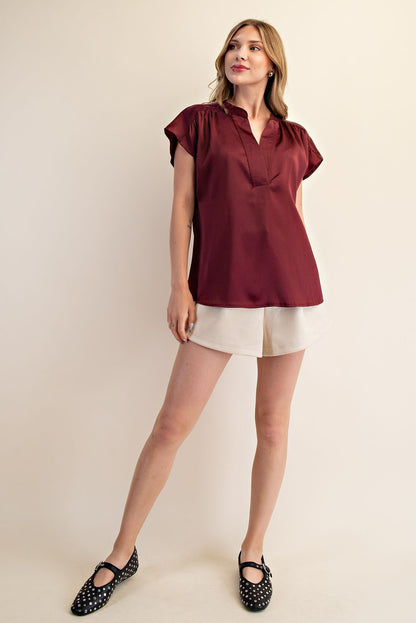 Jami Drop Cap Sleeve Satin Blouse in maroon. Available sizes: XS–XL.