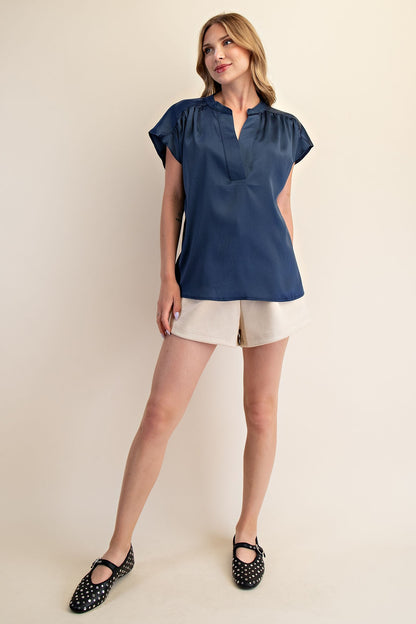 Jami Drop Cap Sleeve Satin Blouse in navy; available in sizes XS-XL.