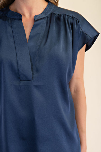Jami Drop Cap Sleeve Satin Blouse: short-sleeve, dark blue, split V-neck, gathered shoulders. Available in sizes XS-XL.