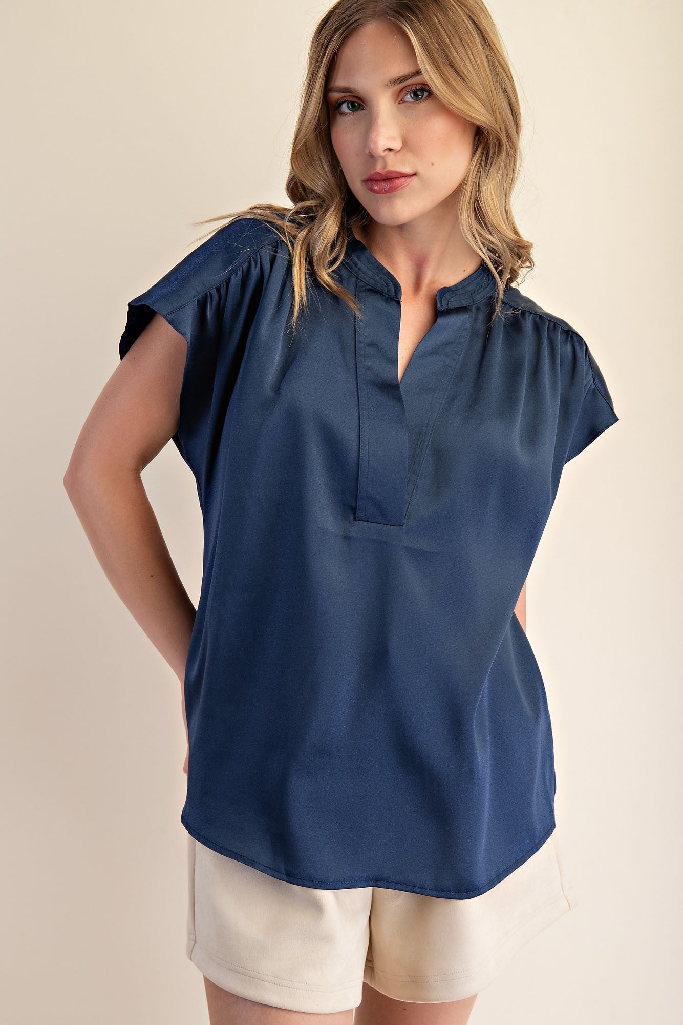 Jami Drop Cap Sleeve Satin Blouse in navy blue. Available sizes: XS-XL.