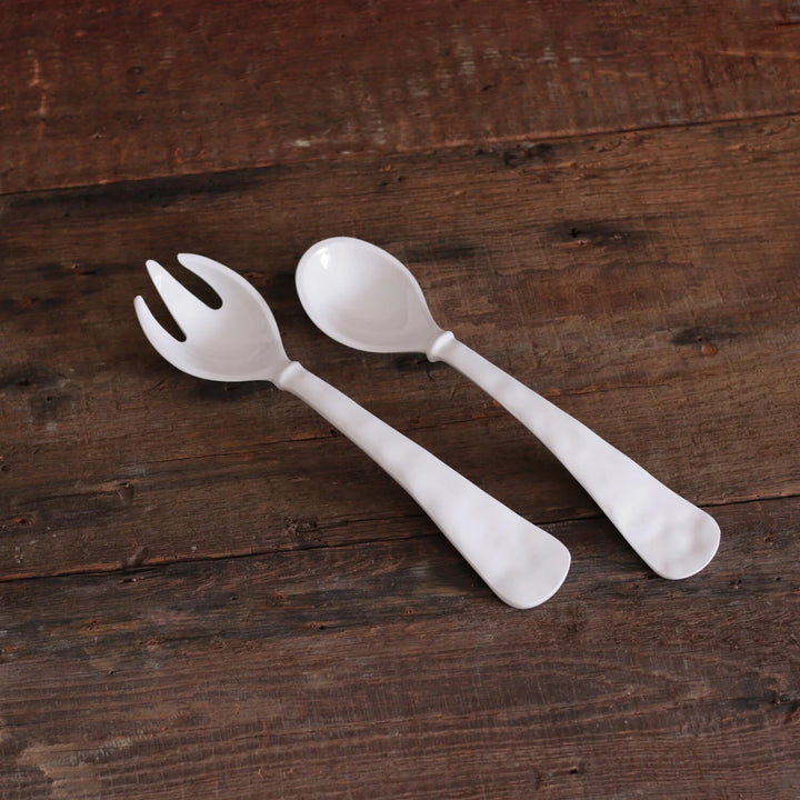 White melamine salad servers, spoon and fork, with wide handles; available in large size from Beatriz Ball.