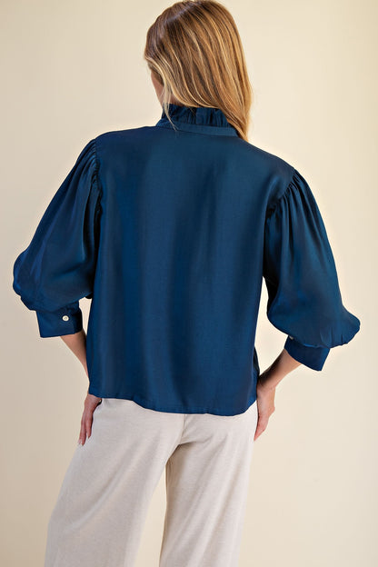 Peacock Blue Ruffle Neck Puff Sleeve Blouse with three-quarter puffed sleeves; available in sizes XS-XL.
