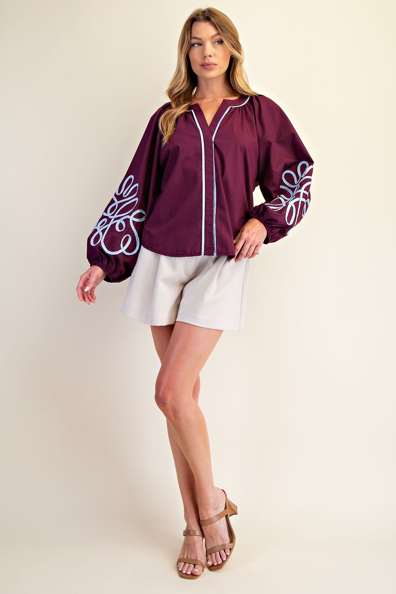 Veronica Soutache Detail Blouse: loose, long-sleeve burgundy top with balloon sleeves and white trim. Sizes XS–XL.