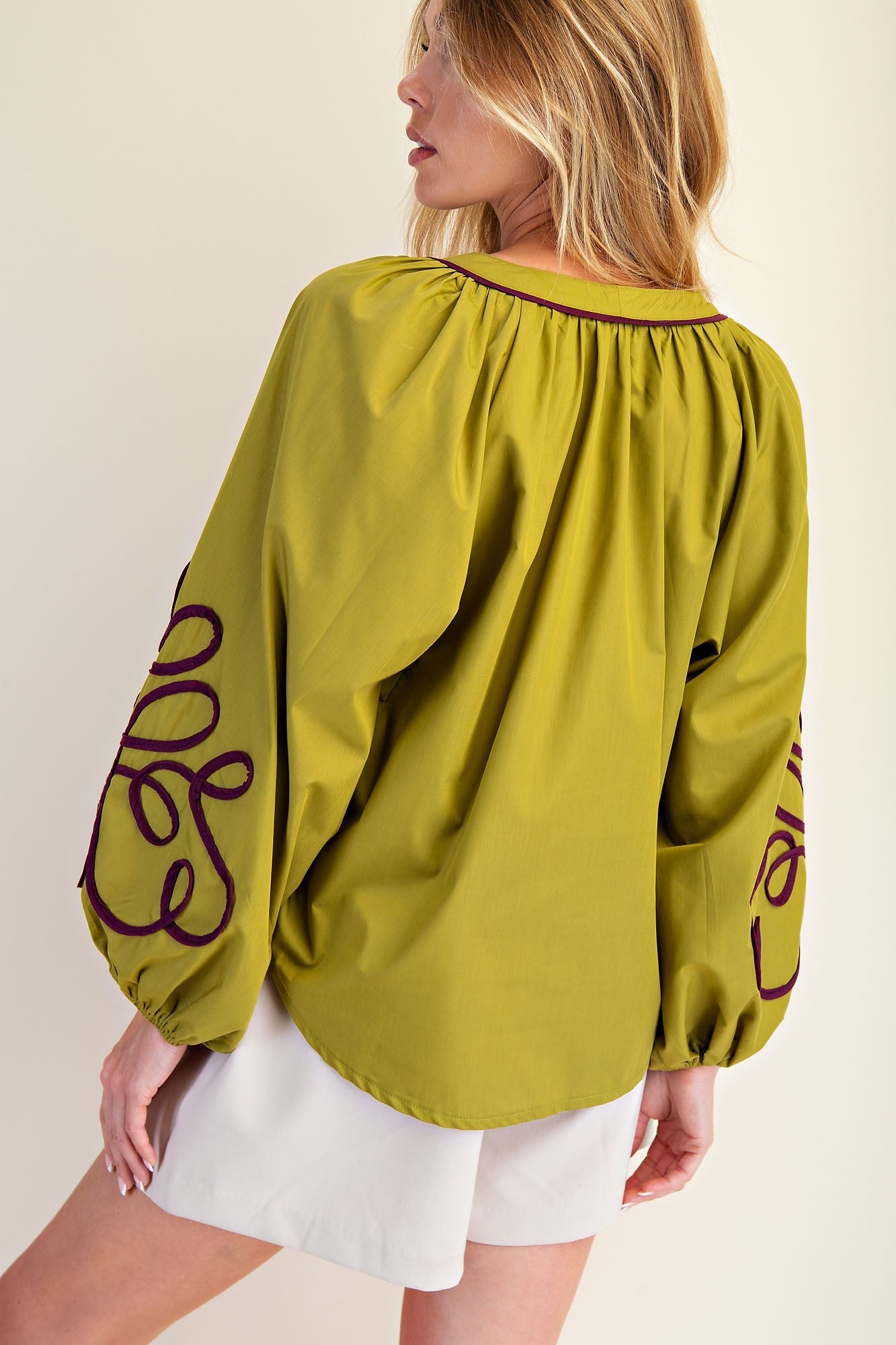 Olive green Veronica Soutache Detail Blouse with balloon sleeves, dark purple embroidery. Available in XS–XL.