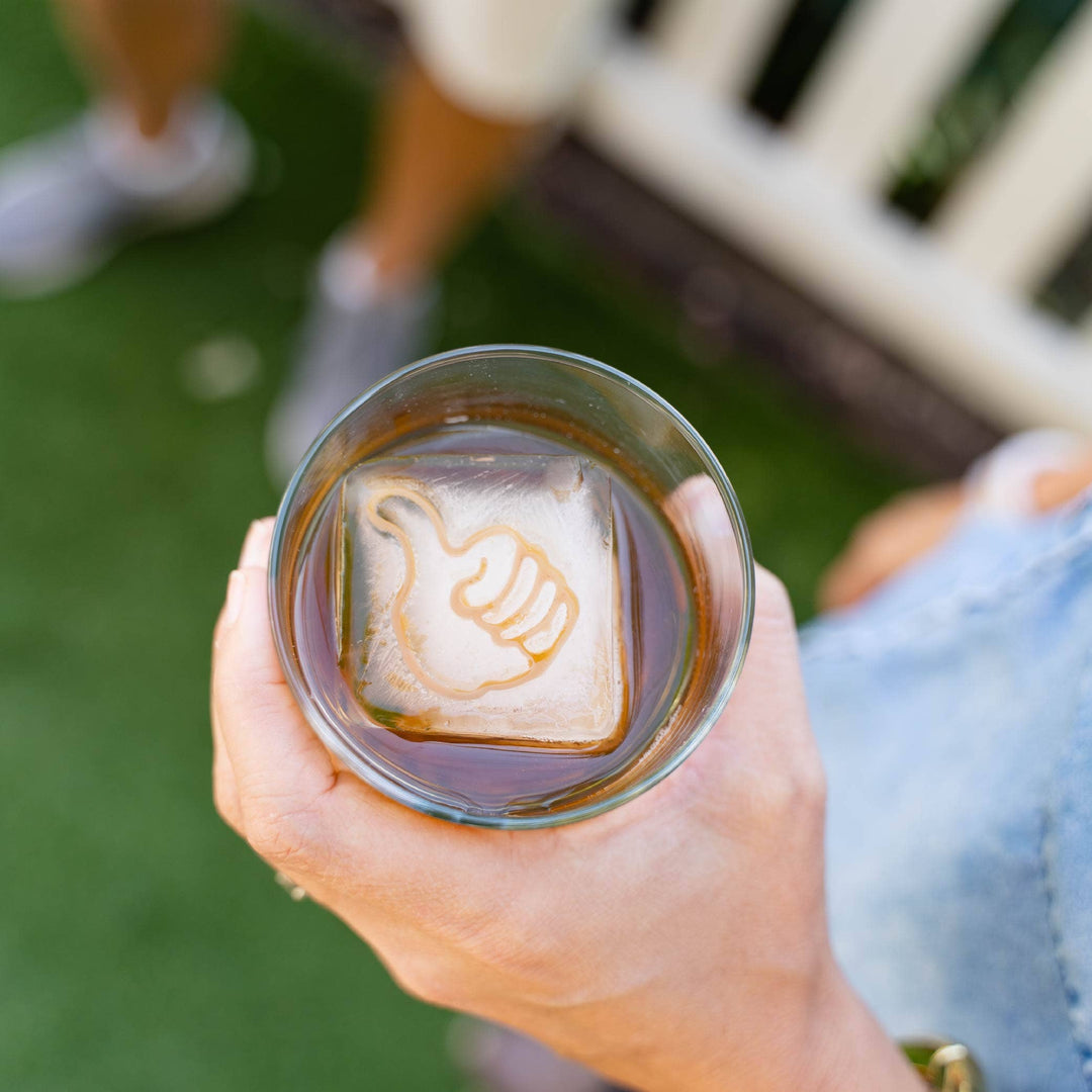 Texas A&amp;M Thumb Insert ice cube, BPA-free silicone, raised thumbs-up; available in small, medium, and large sizes.