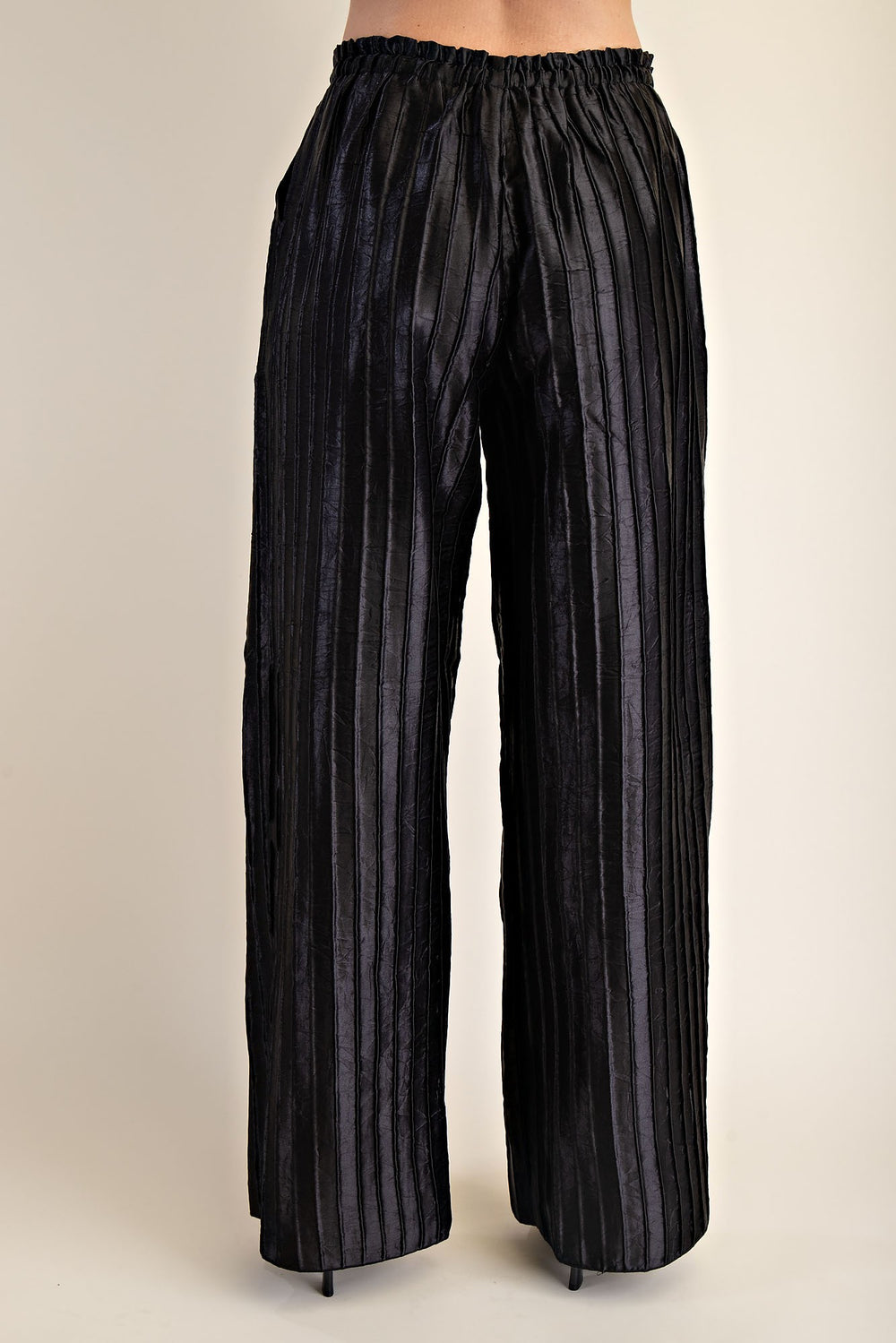 Pitch Flowy Pants: metallic fabric, pleated wide-leg, elastic waistband. Available in sizes XS–XL.