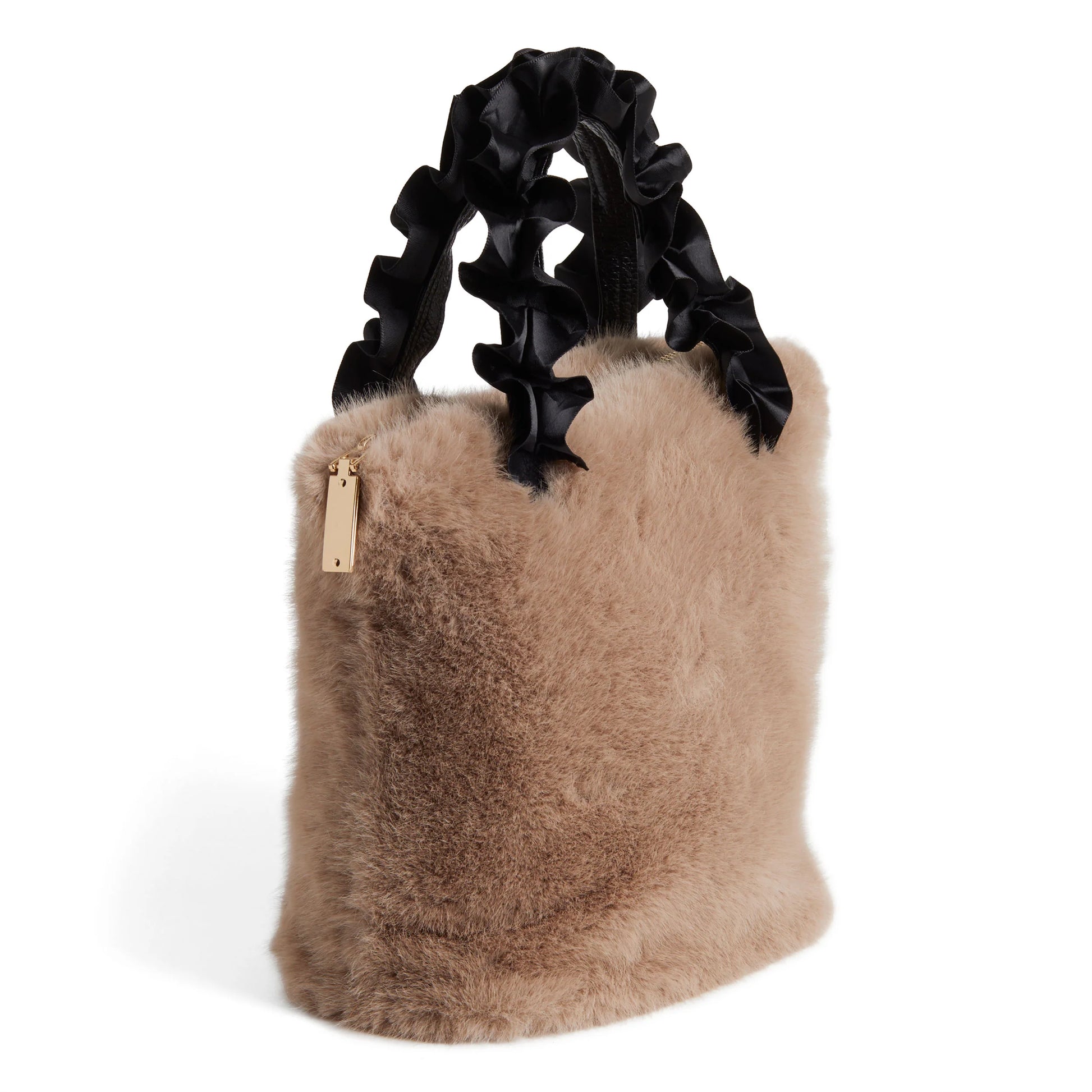 The Larsa Faux Fur Wristlet is a stylish, soft tan faux fur tote bag with black satin pleated handles. It includes a small gold tag on one side. Available in one size.