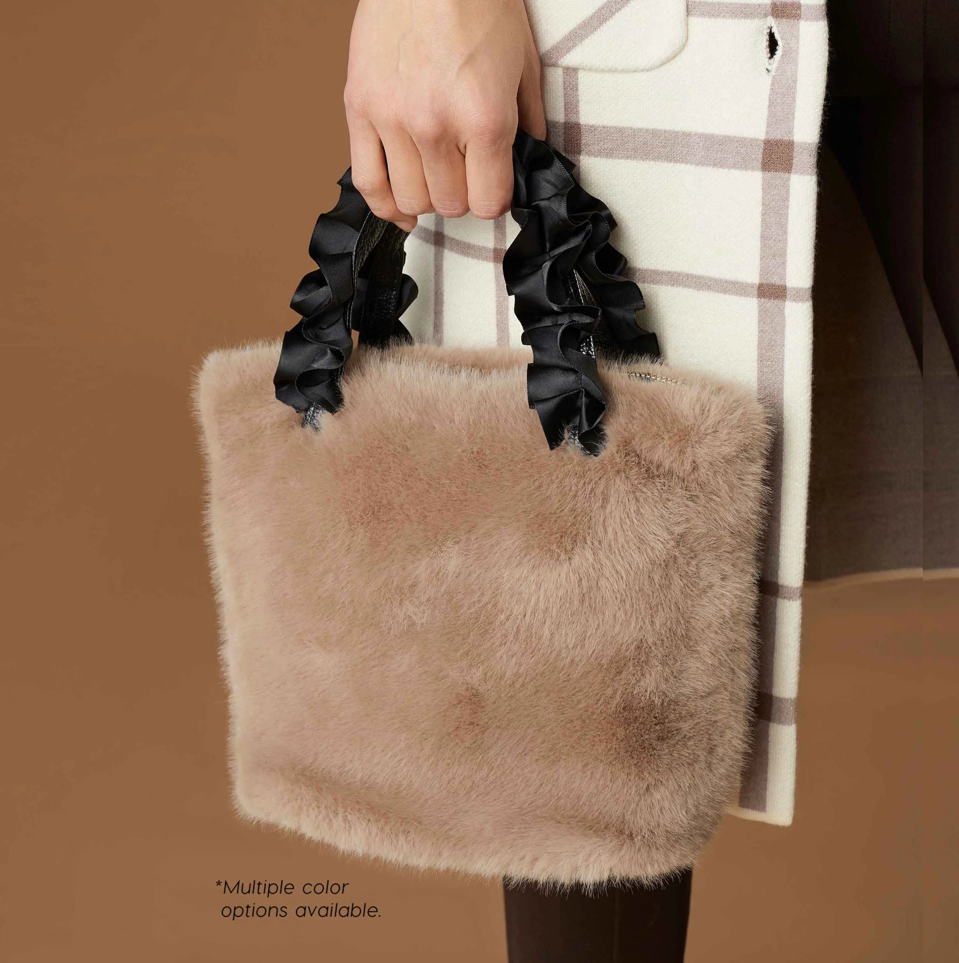 Larsa Faux Fur Wristlet: Beige faux mink bag with black ruffled handles. Chic holiday accessory. Sizes available: Small, Medium, Large. Multiple color options available.*