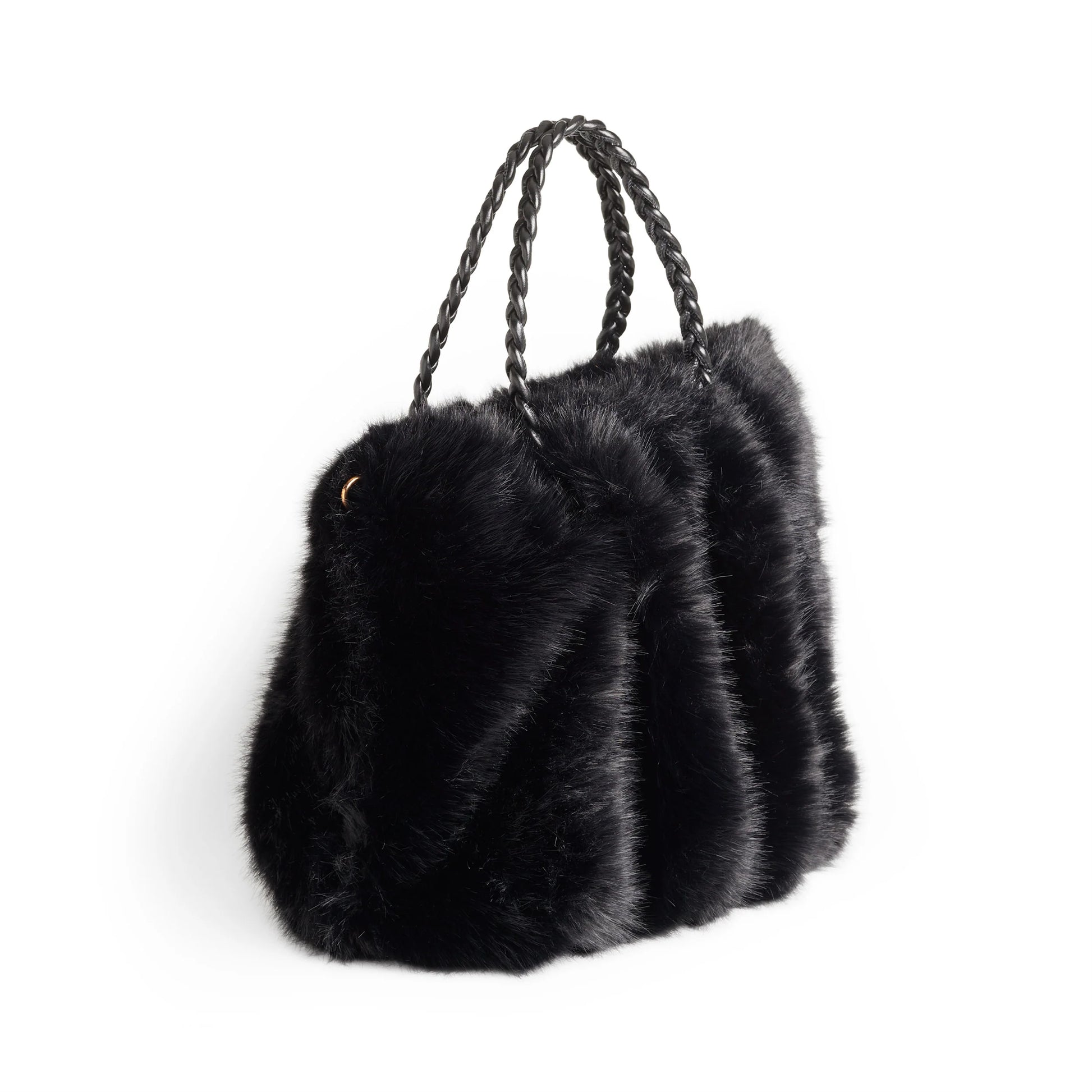 The Priscilla Faux Fur Tote features a plush black faux fur exterior and braided leather handles. Sizes available: Medium, Large.