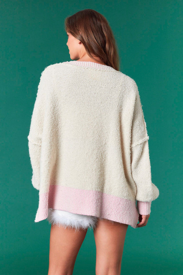 Cream Sequin Bear Nutcracker Sweater with pink hem and cuffs. Available in all sizes.