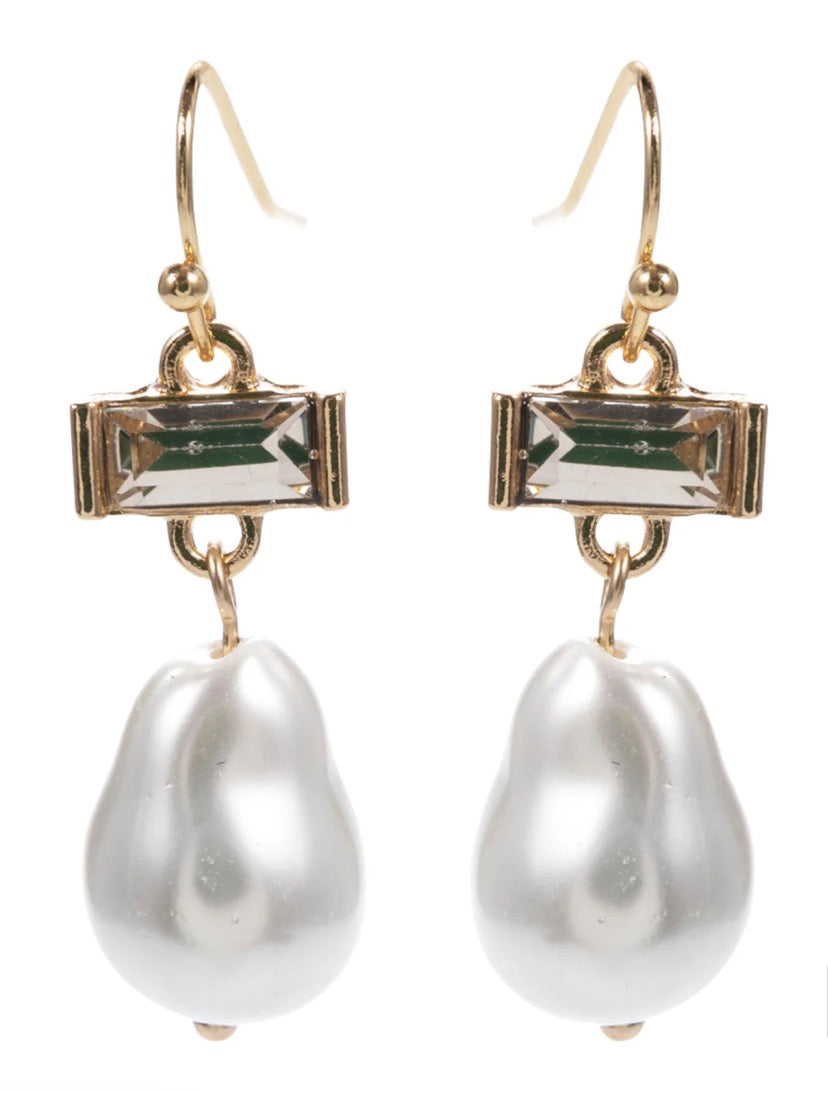 Pearl Drop Earrings feature large, irregular white pearls on gold hooks with rectangular clear gemstones at the top. Available in small, medium, and large sizes.