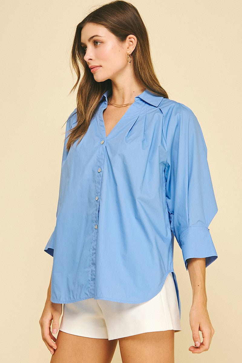 French Blue V-Neck Collar Wide Cuff Shirt with three-quarter sleeves. Available in sizes XS-XL.