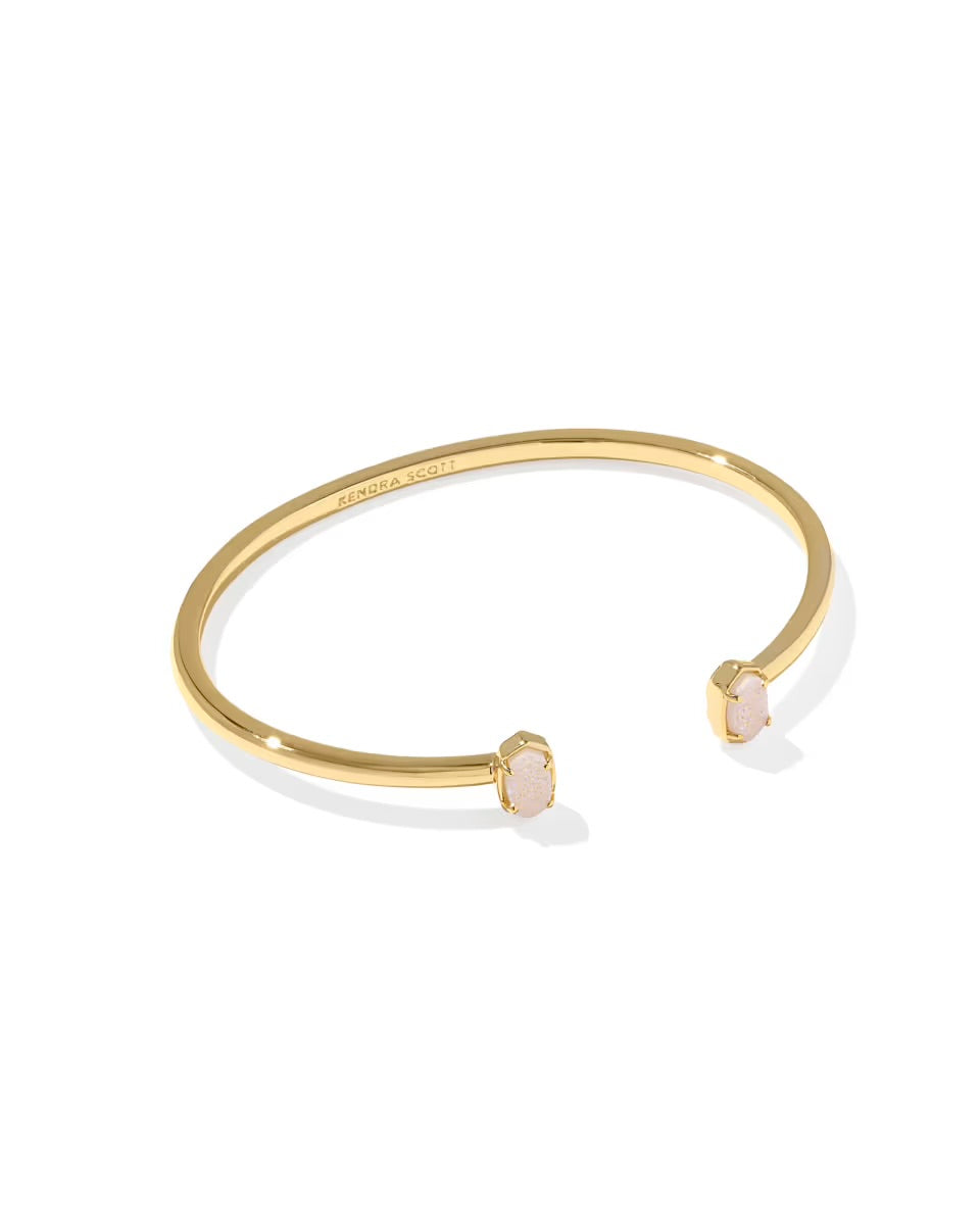 Minimalist gold bangle with two small oval white drusy stones at each end. Available in standard and petite sizes.