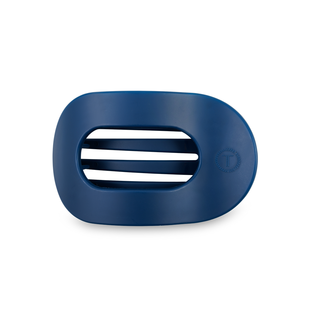 Dark blue oval plastic soap dish with three center slots and a "T" logo. Available in small and large sizes.
