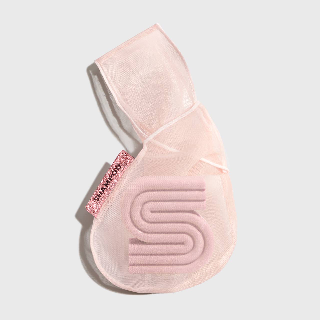 Sheer light pink mesh shampoo bar bag with sparkly "SHAMPOO" tag and textured 'S'. Available in multiple sizes.