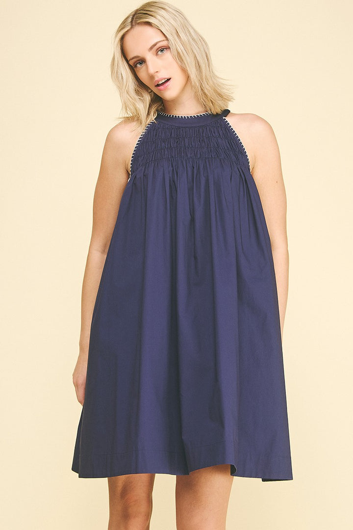 Navy Halter Neck A-line Dress: sleeveless, loose fit, elegant smocking detail. Available in sizes XS-XL.