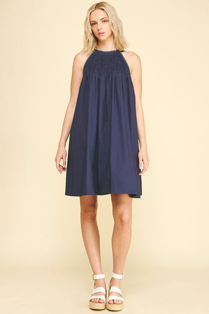 Navy Halter Neck A-line Dress with smocking and gathered neckline; available in sizes XS–XL.