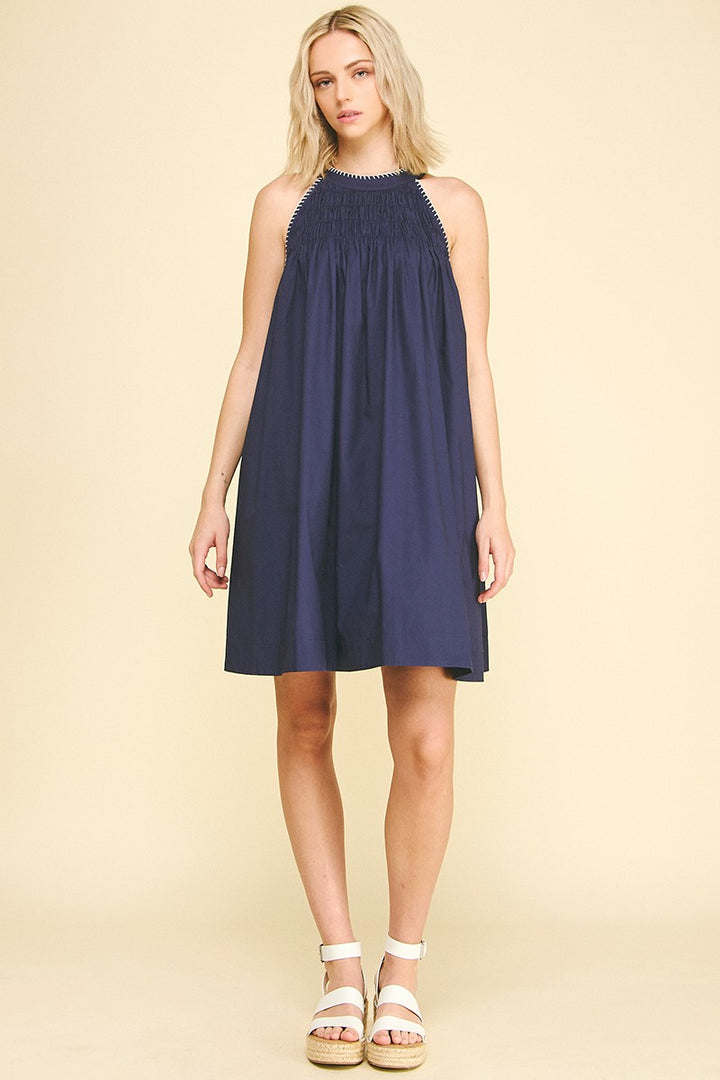 Navy Halter Neck A-line Dress with smocking and gathered neckline; available in sizes XS–XL.