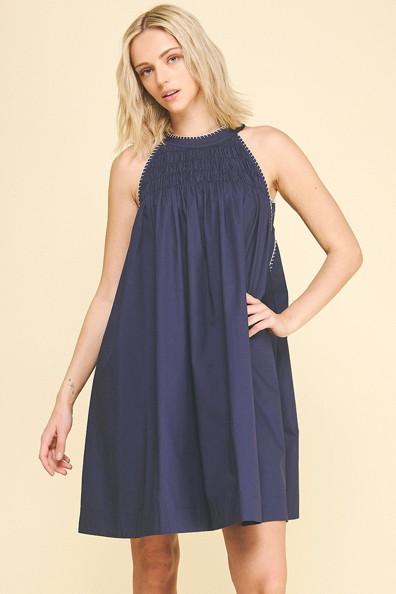 Navy Halter Neck A-line Dress with sleeveless cut and gathered neckline. Available in sizes XS-XL.