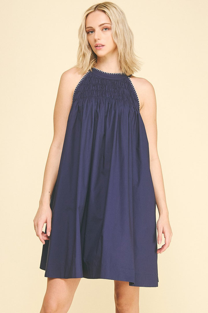 Navy Halter Neck A-line Dress with loose fit and smocked neckline; available in sizes XS-XL.