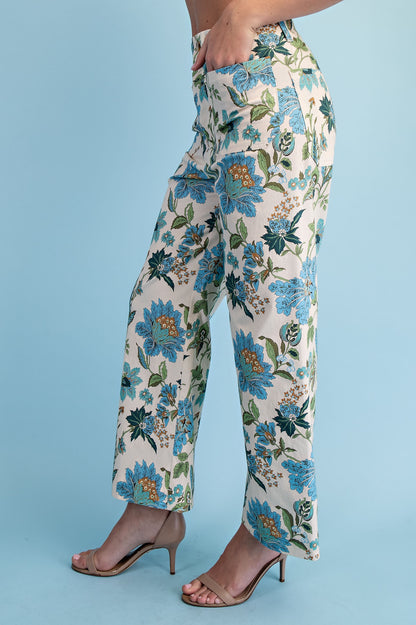 Blue Floral Ankle Cropped Pants with blue and green floral pattern. Available in sizes XS-XL.