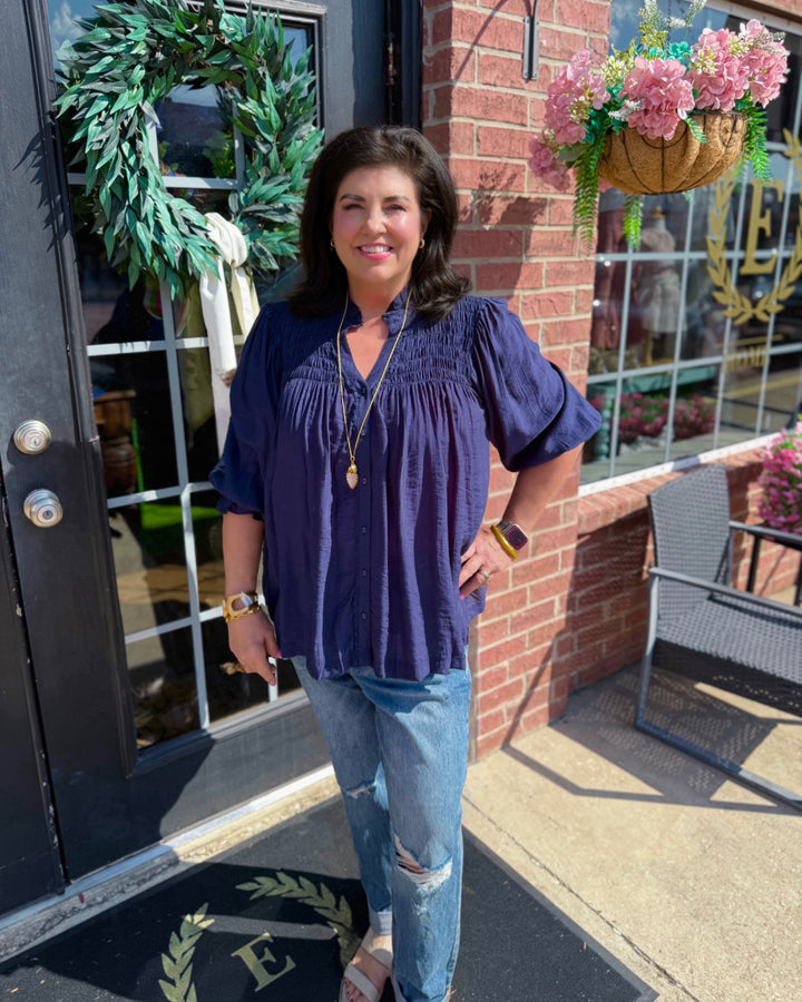 Navy Smocked Yoke Button Front Blouse, available in sizes XS-XL.