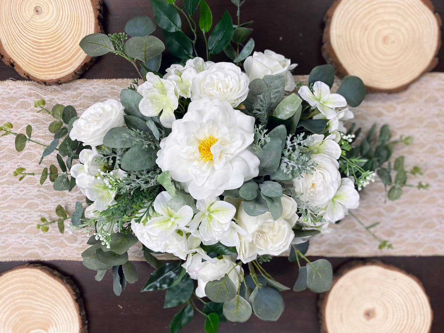 A floral arrangement featuring lifelike Artificial Real Touch Orlane Rose-15" Long: Pure White, peonies, and lilies with green leaves and stems. Size available: 15".