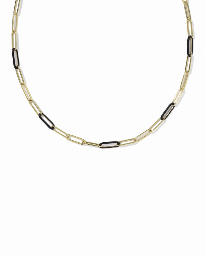 The Courtney Enamel Link Necklace by Kendra Scott features elongated, alternating gold and black links in a bold chain design. Available sizes: 16", 18", and 20".