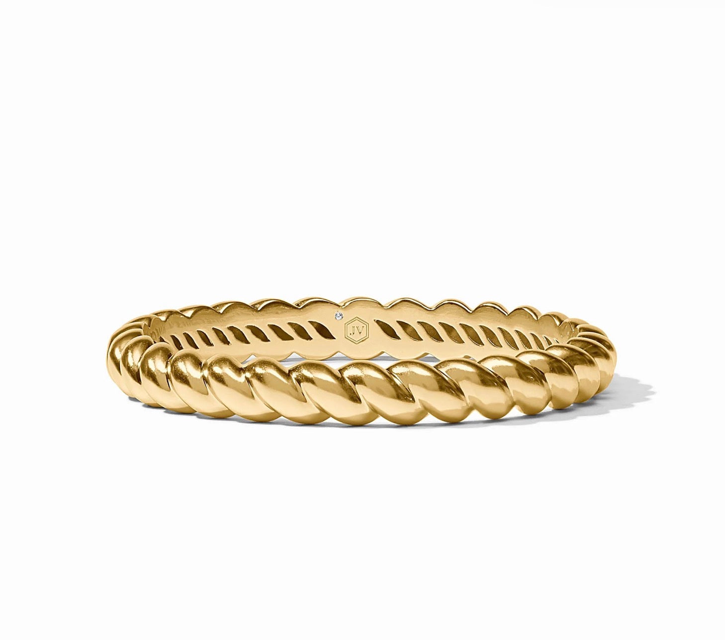 The Ravello Bangle is a 24K gold, twisted rope bracelet with a polished finish, set with a small diamond and an engraved interior logo. Available in multiple sizes.