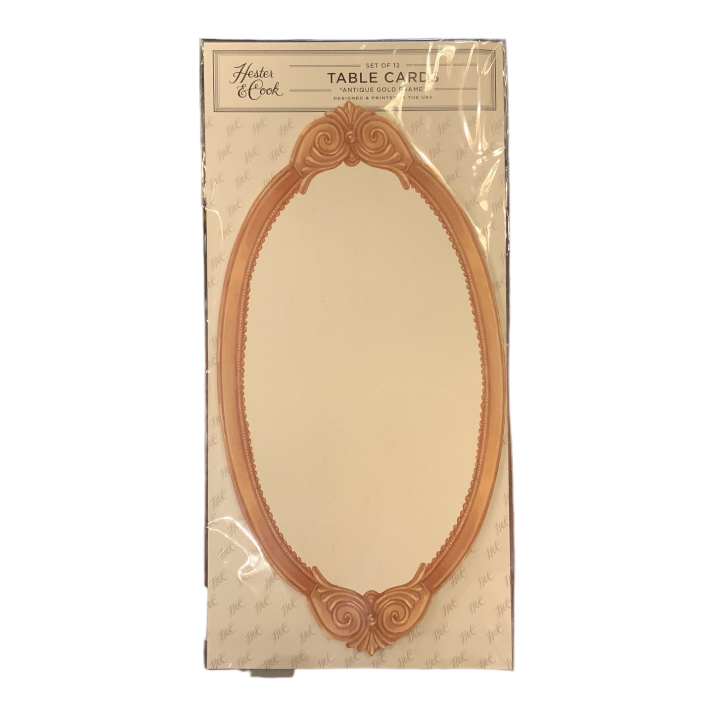 Product Name: Hester & Cook Table Cards

- Set of four beige oval table cards
- Features a decorative Antique Gold Frame border
- Comes in clear plastic packaging
- Available size: Standard size, specific dimensions not detailed.