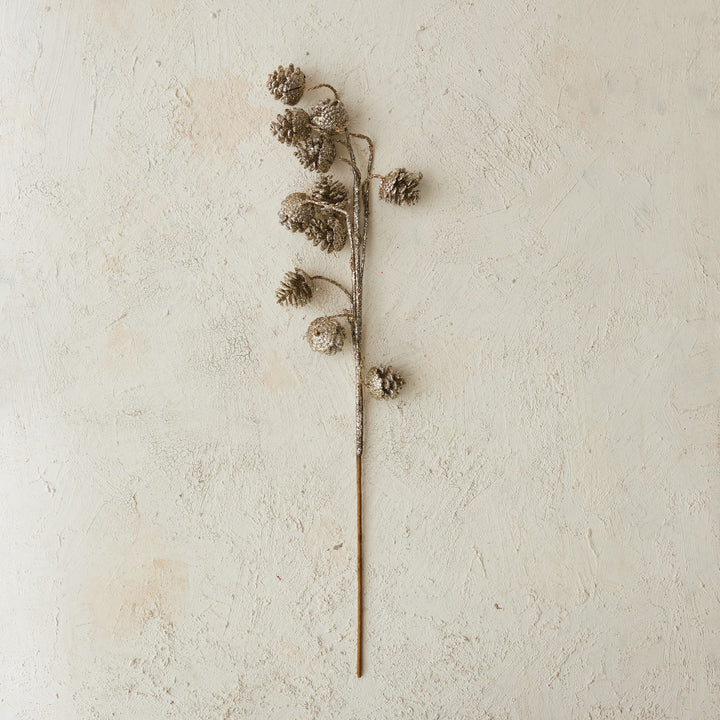 Champagne glitter pinecone stem.