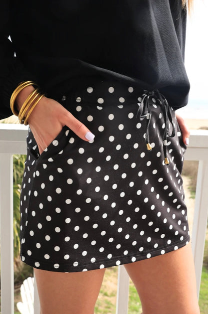 Dot Your Day Performance Skort, available in sizes XS-XL; features pockets and a casual, sporty design.