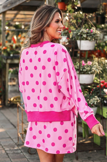 Weekend Escape Terry Skort Set: long-sleeve pink top with bright pink polka dots and matching skirt. Available in sizes XS-XL.