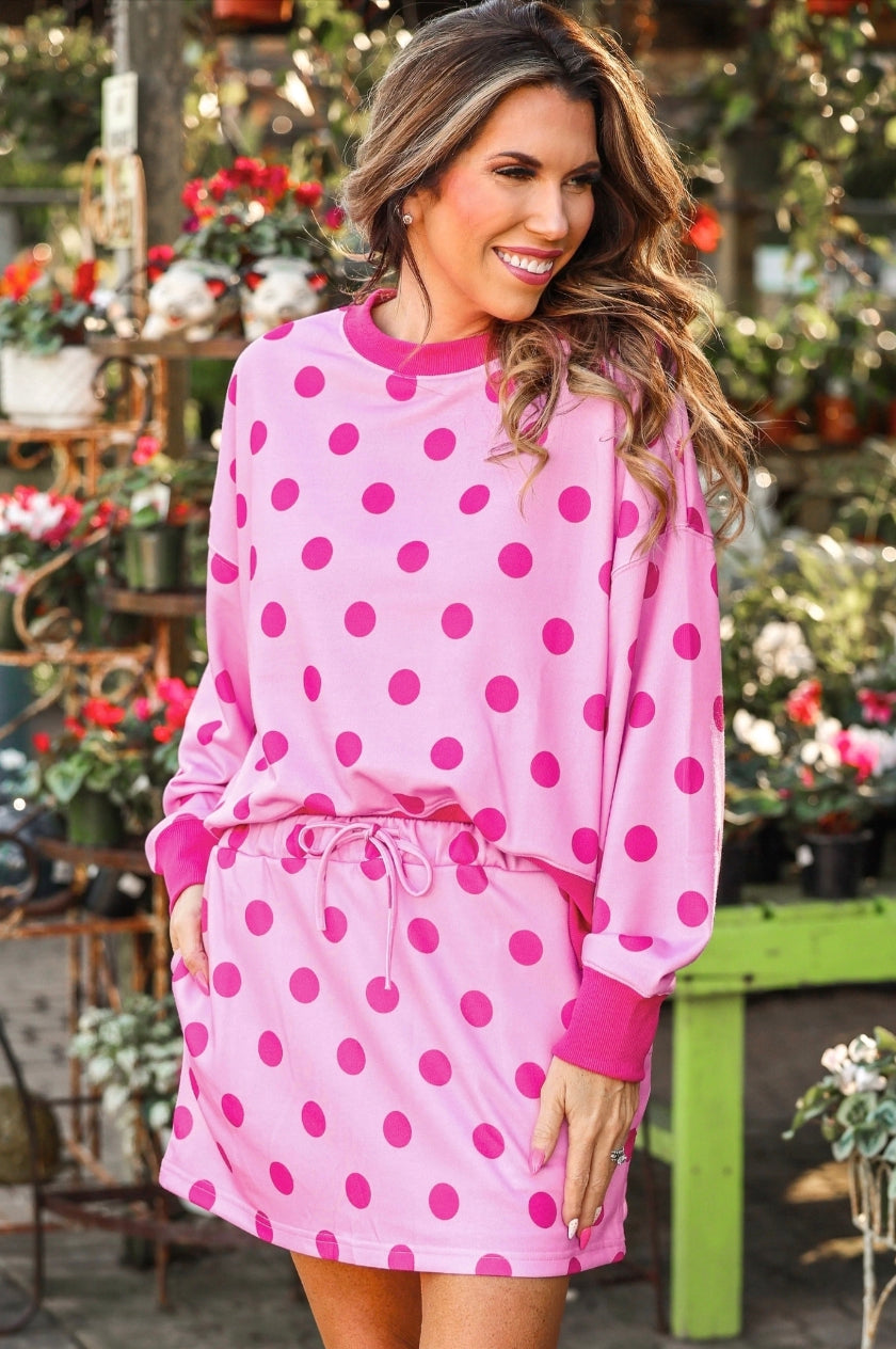 Weekend Escape Terry Skort Set in bright pink polka dots. Available in sizes XS–XL.