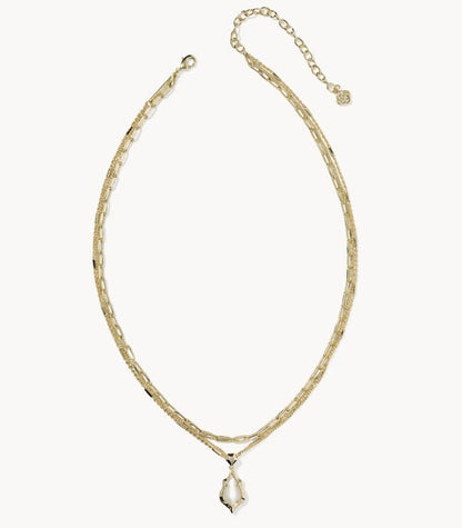 Adriana Scallop Frame Gold Necklace: multi-strand gold, white irregular pendant, pink abalone finish, adjustable clasp. Sizes: S/M/L.