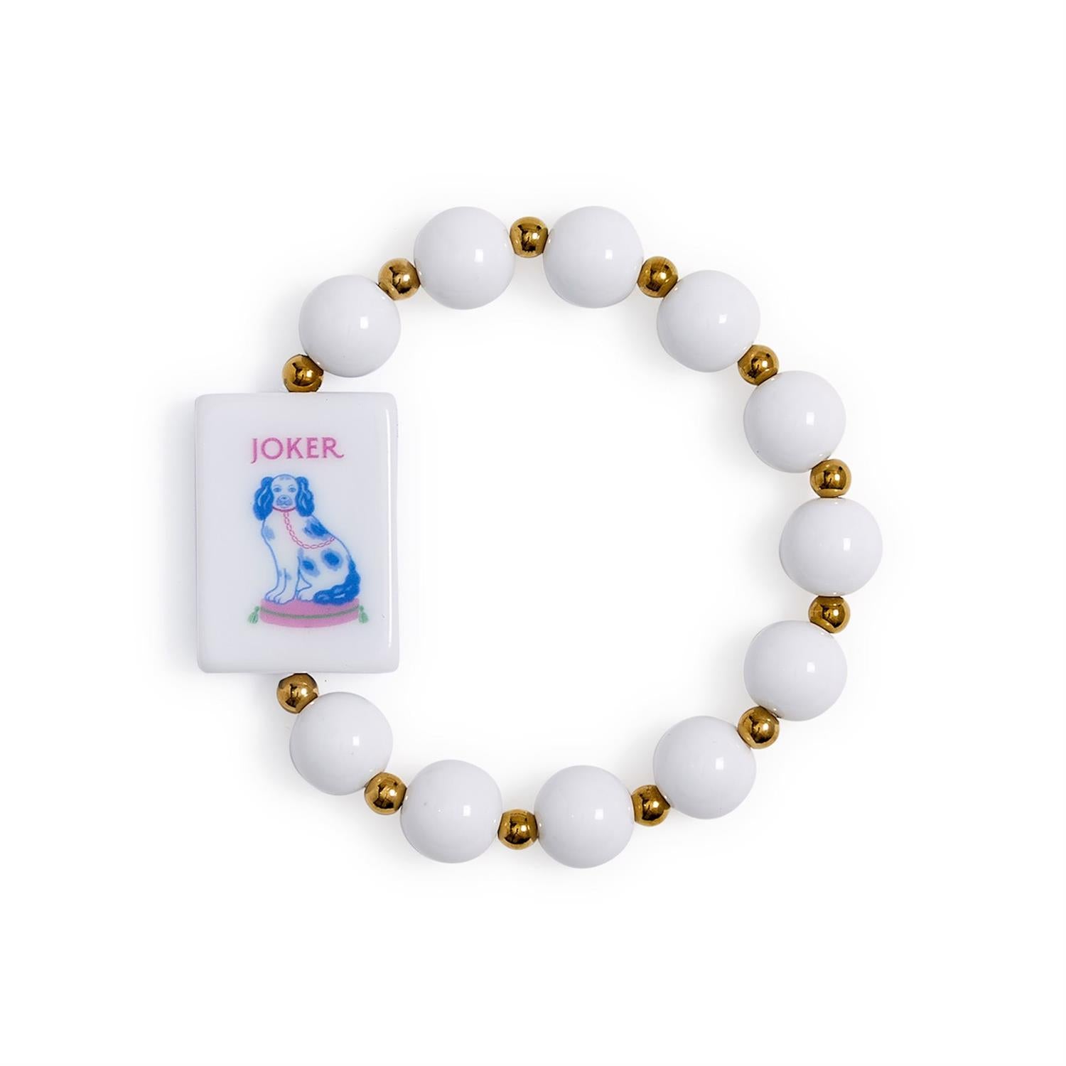 Mahjong Beaded Stretch Bracelet with alternating white and gold beads, colorful acrylic accents, and a rectangular charm featuring a blue-and-white dog and “JOKER” in pink text. Available in multiple sizes.