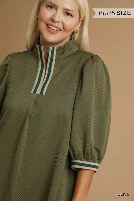 Olive Jacquard High Neck Dress in olive green with textured fabric, stand collar, striped trim. Available in sizes XS–XL.