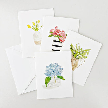 Set of 8 unique watercolor flower notecards with matching white envelopes. Each card features a distinct floral vase design. Size: A2.
