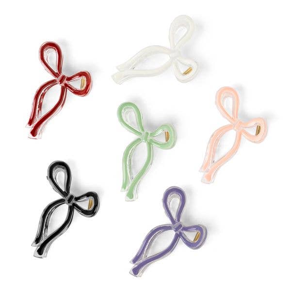 Six Crush Very Demure Bow Hair Clips in six colors, each with a metallic center clasp. Available in small and medium sizes.